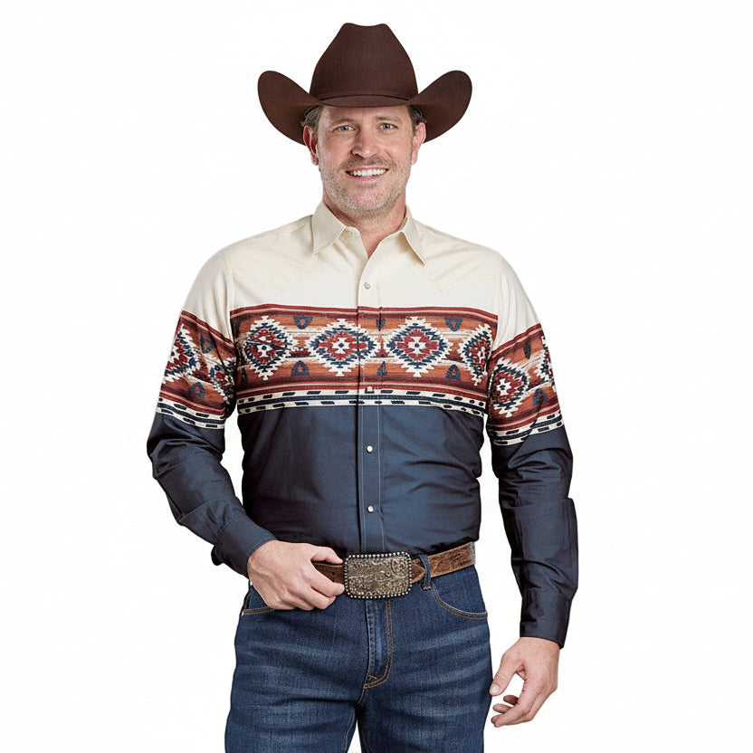 Man wearing a patterned shirt with a cowboy hat and jeans on a plain background