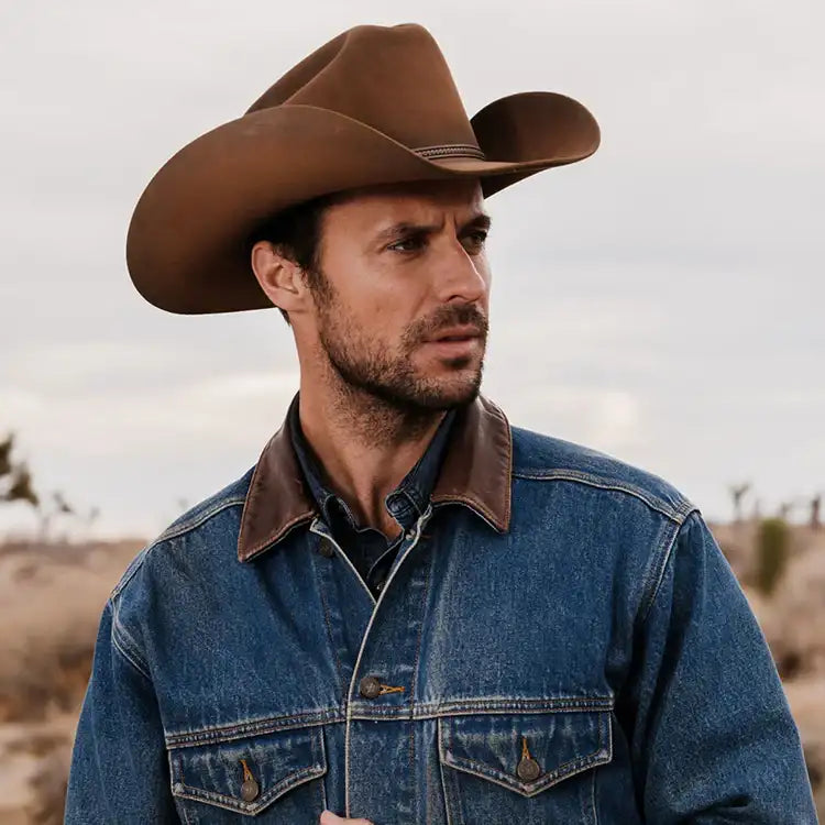 Brown leather cowboy hat with a stitched band.